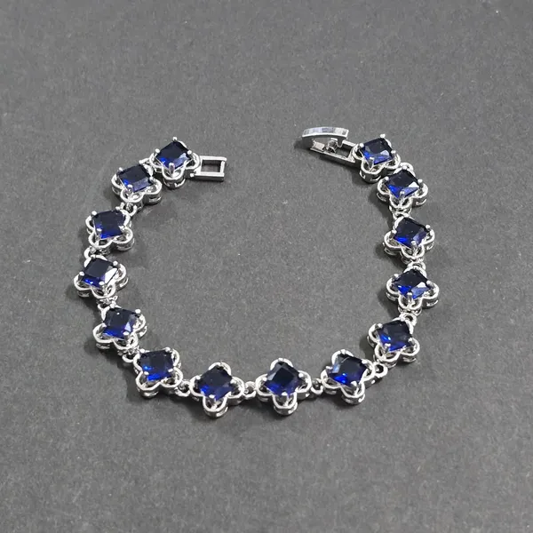 Royal_Azure"_Princess-Cut_Sapphire_Blue_Tennis_Bracelet_in_Floral_Filigree