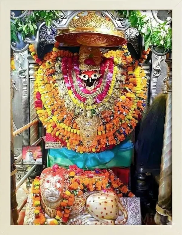 Decorative_Golden_Deity_Idol_With_Ornamental_Accessories_And_Garlands