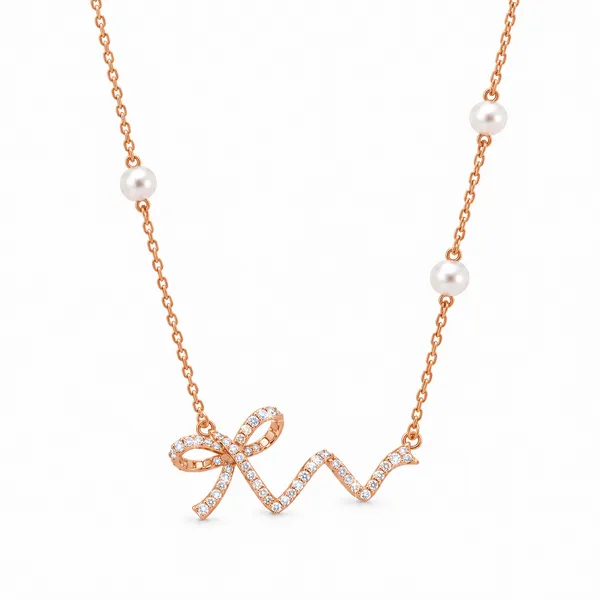 Bow_Neckchain_With_Pearl_Accents_|_Sterling_Silver