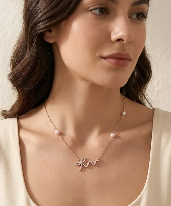 Bow_Neckchain_With_Pearl_Accents_|_Sterling_Silver