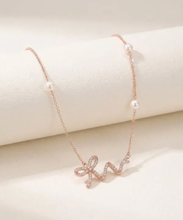 Bow_Neckchain_With_Pearl_Accents_|_Sterling_Silver