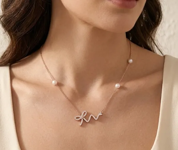 Bow_Neckchain_With_Pearl_Accents_|_Sterling_Silver