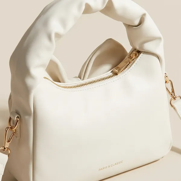 Elegant_Cream_Bow_Accent_Handbag_With_Twisted_Handle
