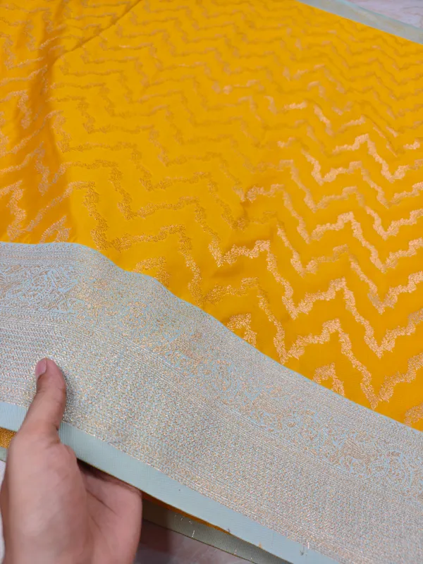 BANARASI_KATAN_SILK_IN_AIRY_GOLD_WITH_LIGHT_BLUE_BORDER