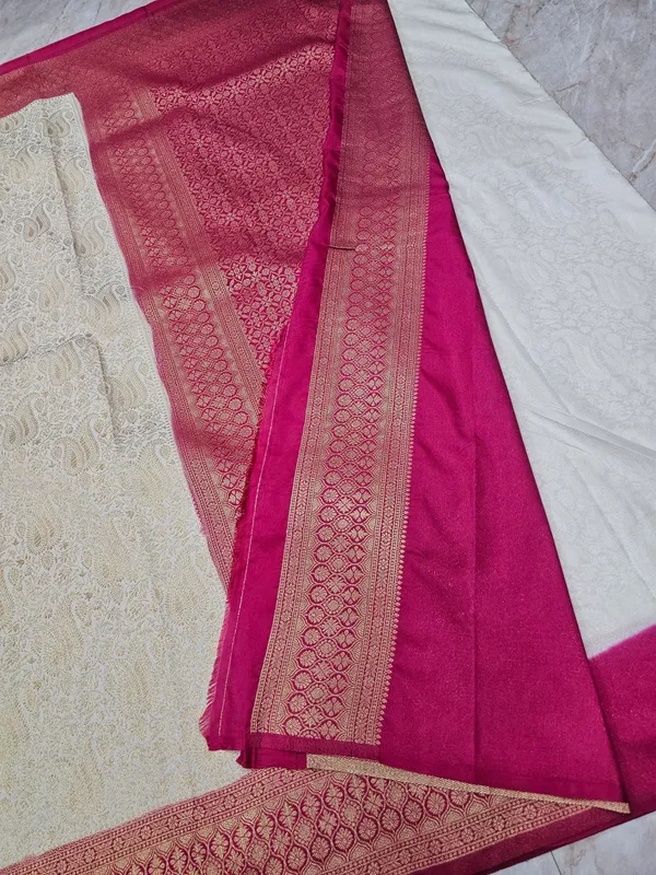 KHADDI_GEORGETTE_IN_CREAM_WITH_RED_BORDER