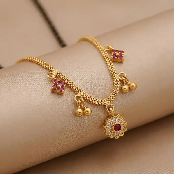 Dual-Tone_Black_And_Gold_Mangalsutra_Set_With_Pink_Stone_Floral_Pendant_And_Traditional_Black_Beaded_Mangalsutra_With_Golden_Pendant_Charms_(Pack_Of_2)