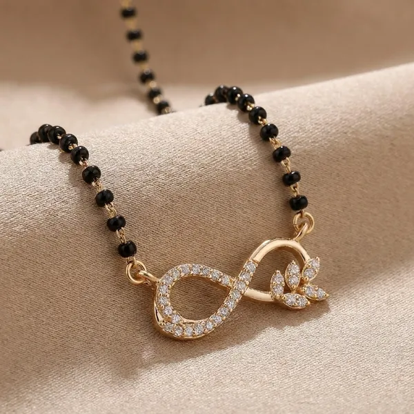 Black_Beaded_Infinity_Necklace_With_Rose_Gold_Crystal_Accents