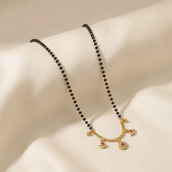 Traditional_Black_Beaded_Mangalsutra_With_Golden_Pendant_Charms
