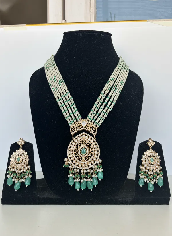 Regal_Multi_Strand_Pearl_And_Emerald_Kundan_Pendant_Set