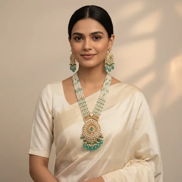 Regal_Multi_Strand_Pearl_And_Emerald_Kundan_Pendant_Set