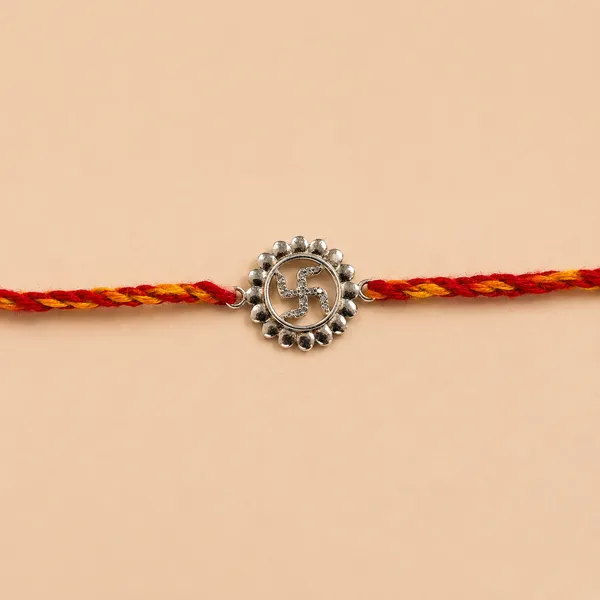 Divine_Swastika_Rakhi_(Sterling_Silver_925)_In_Sacred_Thread