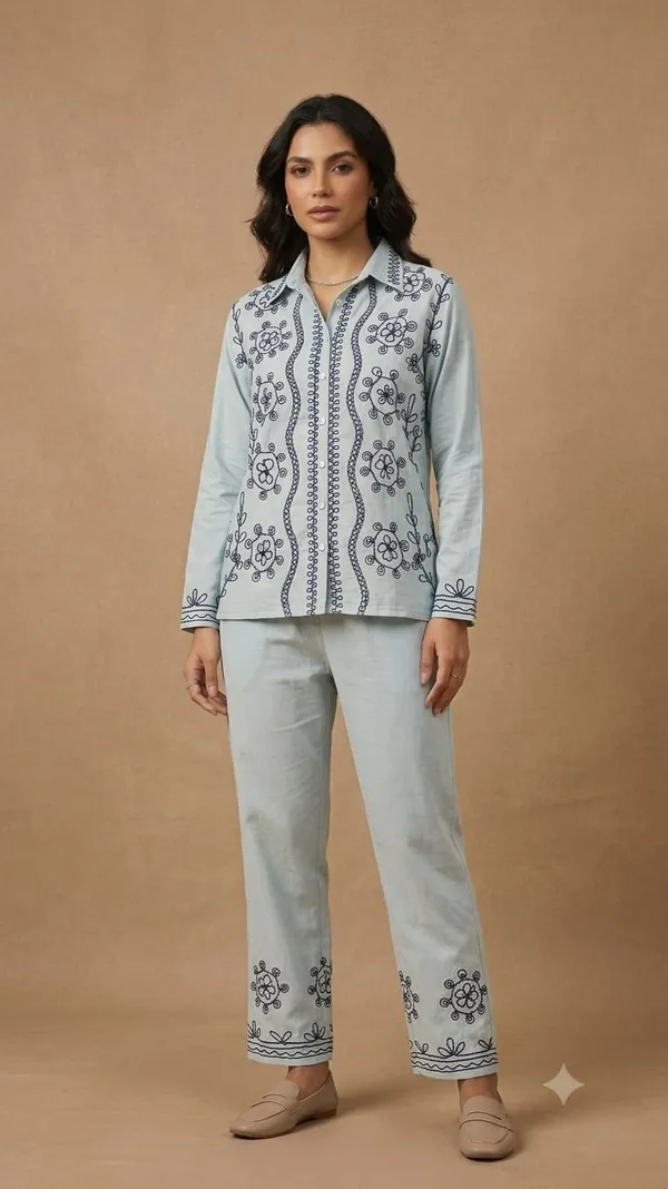A_striking_vertical_embroidered_vine_runs_parallel_to_the_button_placket,_accentuating_the_garment's_clean_lines.