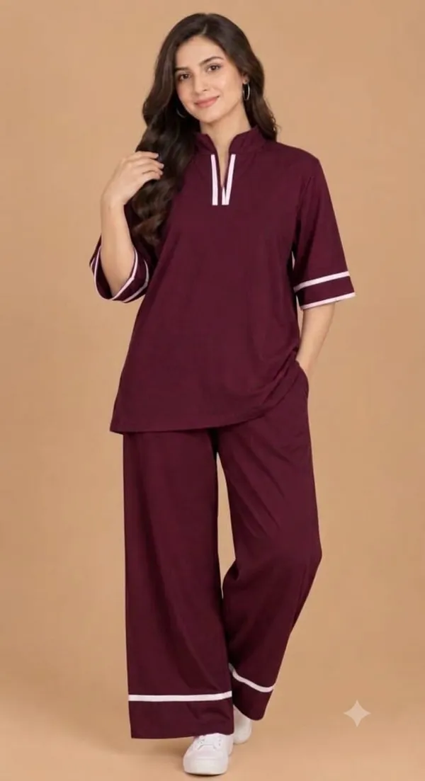 A_stylish_maroon_co-ord_set_consisting_of_a_half-sleeve_top_and_matching_wide-leg_pants.