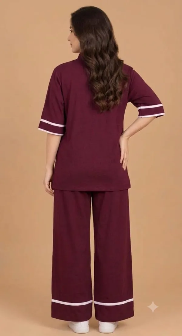 A_stylish_maroon_co-ord_set_consisting_of_a_half-sleeve_top_and_matching_wide-leg_pants.