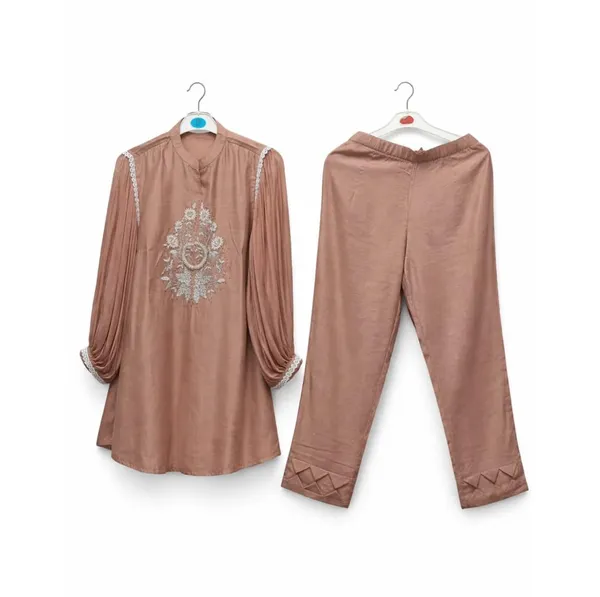 Beautiful_dusty_peach_two-piece_ethnic_set_featuring_a_sophisticated_kurta_with_delicate_embroidery.