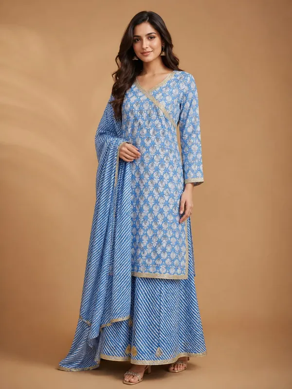 Straight-cut_blue_kurta_adorned_with_all-over_white_floral_prints_Matching_flared_blue_skirt_featuring_diagonal_white_stripes,_