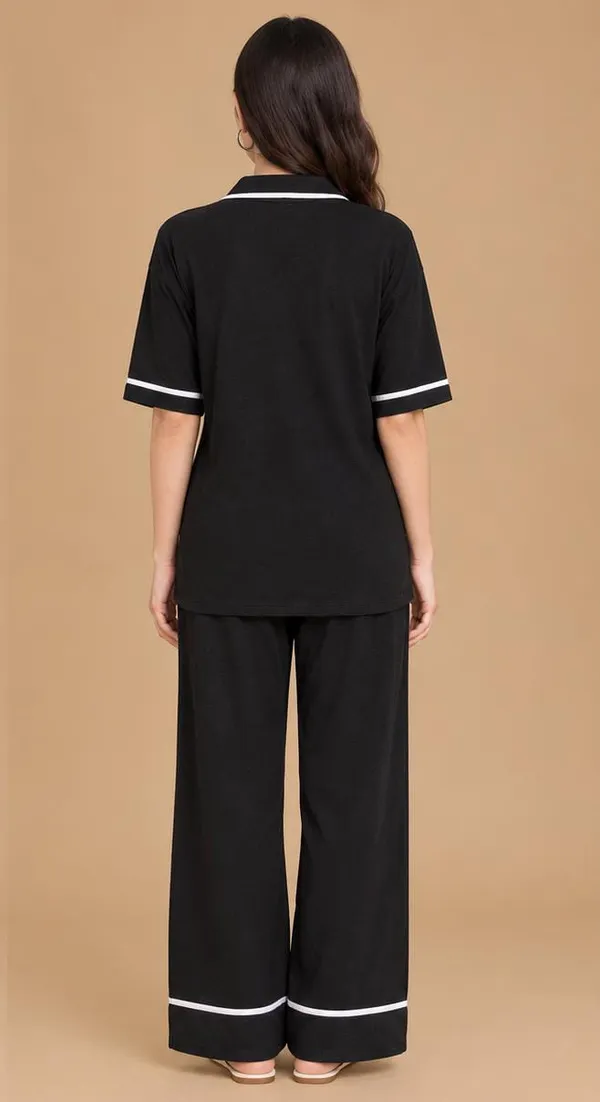 Stylish_black_two-piece_lounge_set_featuring_a_relaxed-fit_top_with_a_smart_collared_V-neckline_and_matching_wide-leg_trousers.