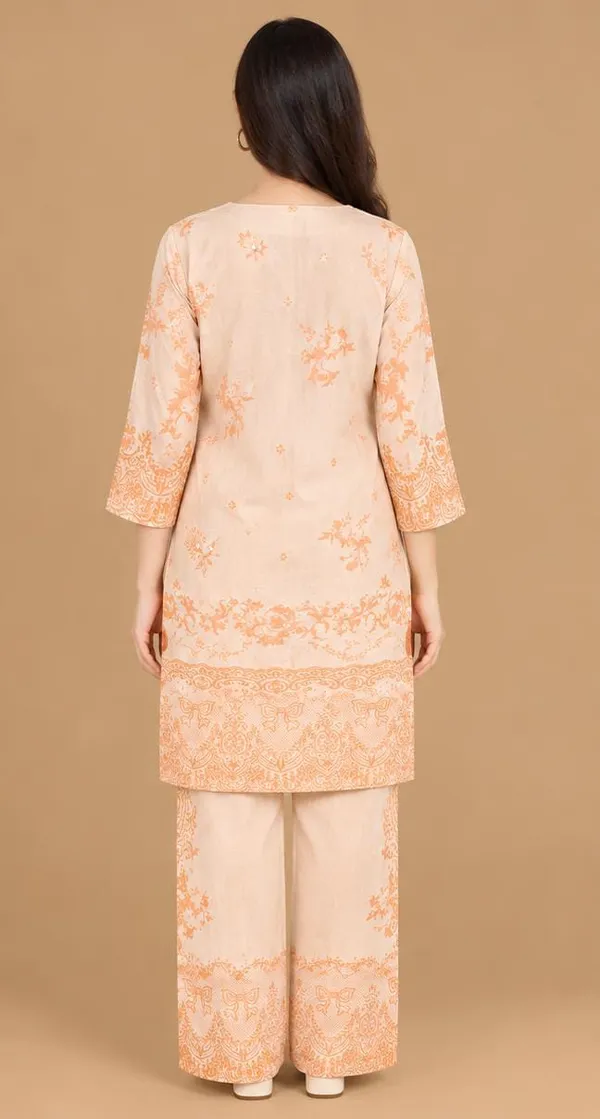 peach-coloured_co-ord_set_featuring_delicate_floral,_ornamental_and_traditional_border_prints.