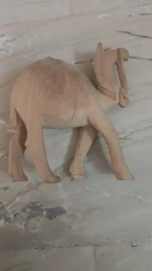 Handcrafted_Wooden_Camel_Figurine_With_Intricate_Jali_Work