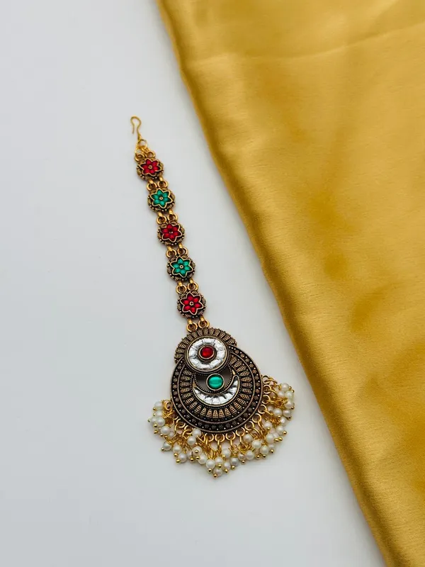 Antique_Gold_Plated_Maang_Tikka_With_Colorful_Gemstone_Accents_And_Pearl_Fringe