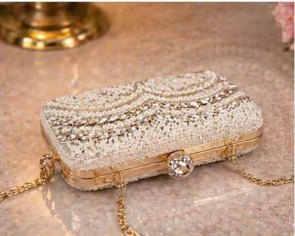 Handcrafted_Pearl_and_Crystal_Embellished_Evening_Clutch_with_Metal_Handle