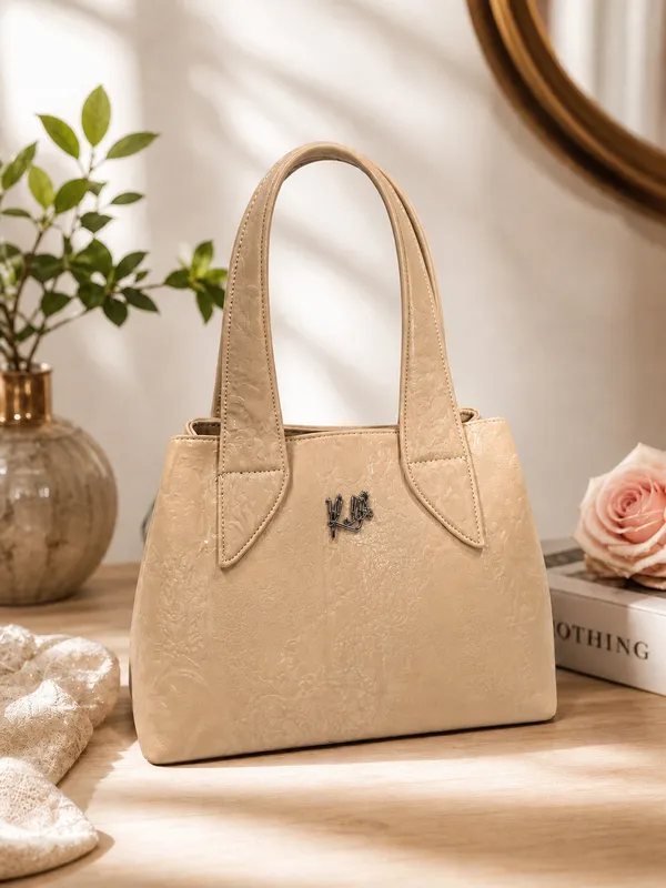 Elegant_Beige_Textured_Handbag_with_Metal_Logo