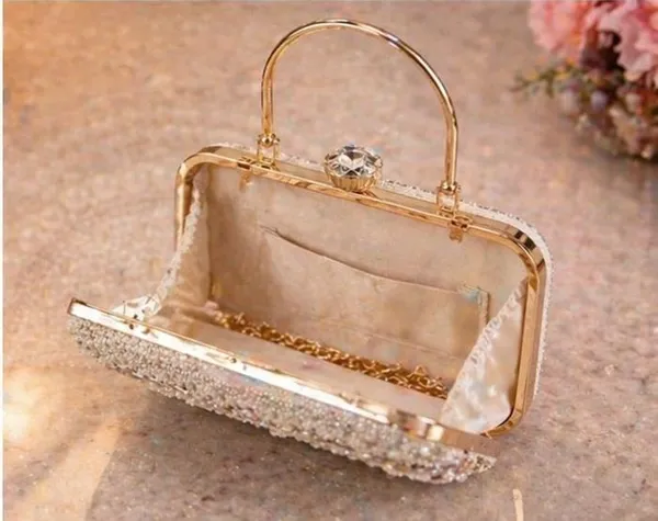 Handcrafted_Pearl_and_Crystal_Embellished_Evening_Clutch_with_Metal_Handle