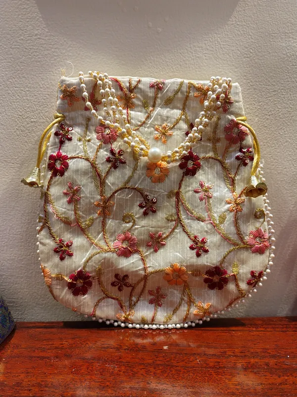 Elegant_Embroidered_Silk_Potli_Bag_With_Pearl_Handle_For_Women