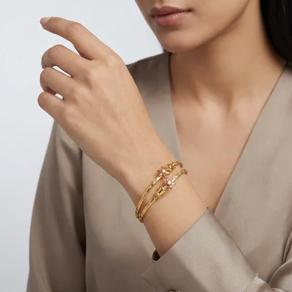 Elegant_Gold_Toned_Stackable_Bangle_Set_With_Crystal_Accents
