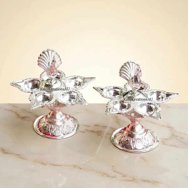 Vintage_Silver_Finish_Plated_Artisanal_Diya_Stand_With_Regal_Peacock_Design_Pack_Of_2