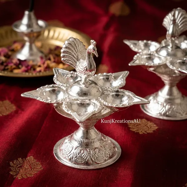Vintage_Silver_Finish_Plated_Artisanal_Diya_Stand_With_Regal_Peacock_Design_Pack_Of_2