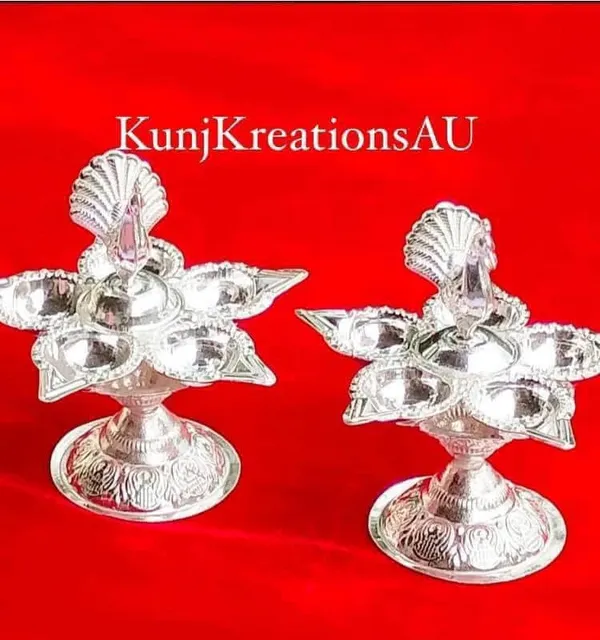 Vintage_Silver_Finish_Plated_Artisanal_Diya_Stand_With_Regal_Peacock_Design_Pack_Of_2