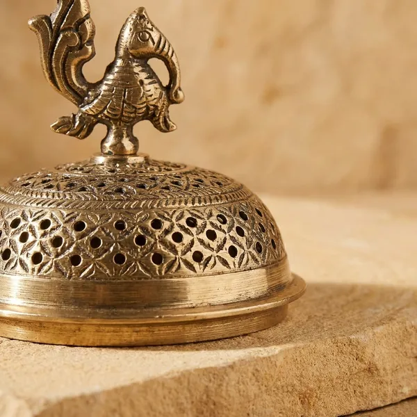 Artisanal_Polished_Brass_Incense_Burner_With_Regal_Peacock_Design