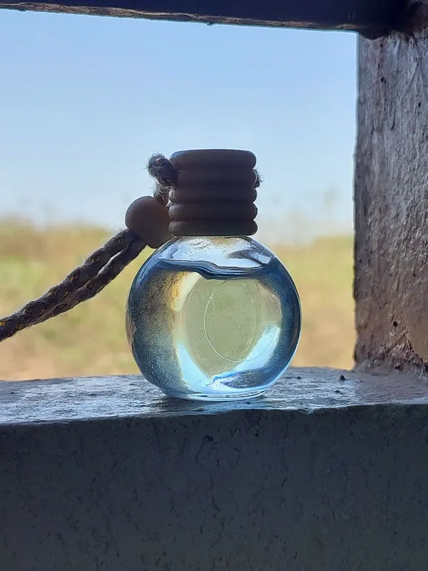 Clear_Glass_Bottle_Pendant_With_Wooden_Stopper_Braided_Cord