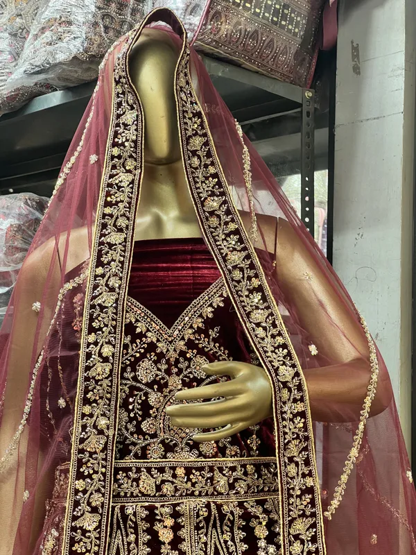 Maroon_Velvet_Bridal_Lehenga_Choli_Set_With_Golden_Zari_Work