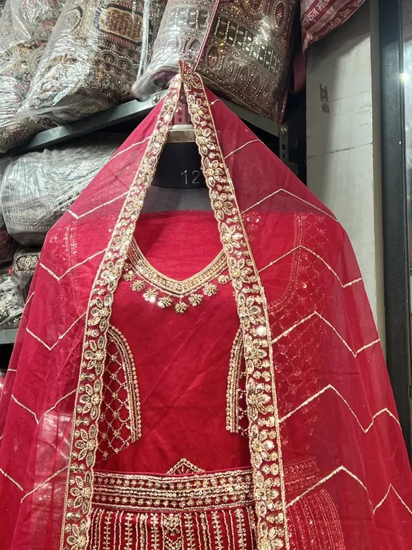 Red_Net_Bridal_Lehenga_Choli_Set_With_Heavy_Embroidery