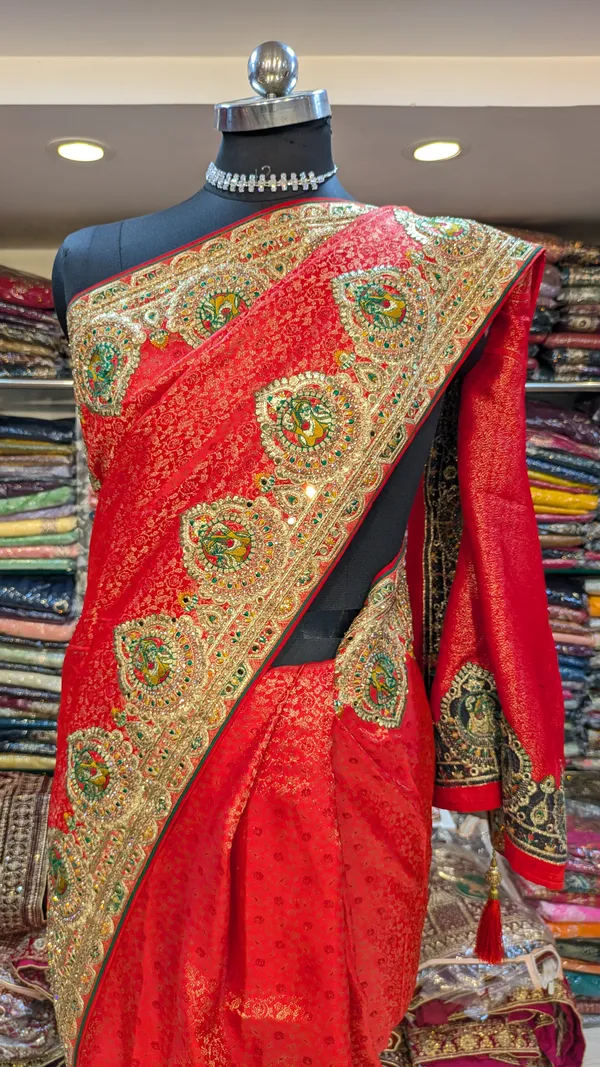 Red_Satin_Silk_Bridal_Saree_With_Heavy_Gold_Border_And_Peacock_Motifs