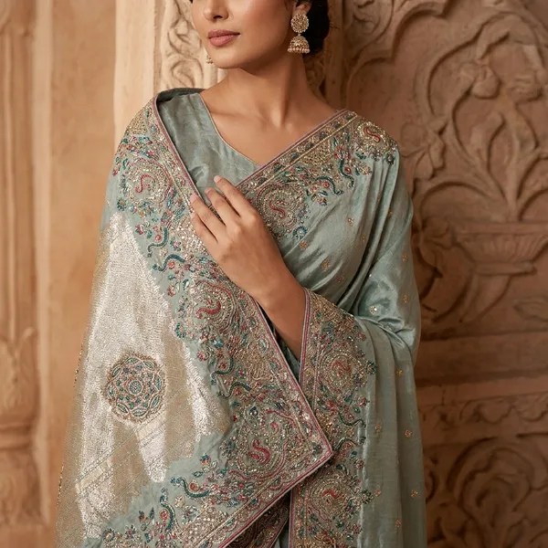 Pastel_Green_Silk_Saree_With_Heavy_Embellished_Border_Work