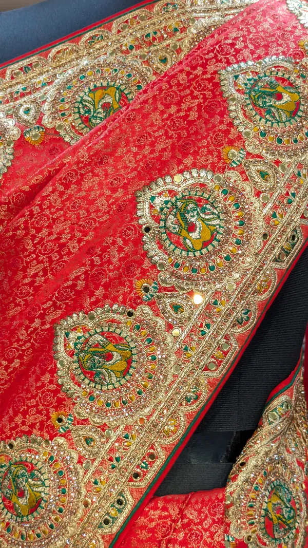 Red_Satin_Silk_Bridal_Saree_With_Heavy_Gold_Border_And_Peacock_Motifs
