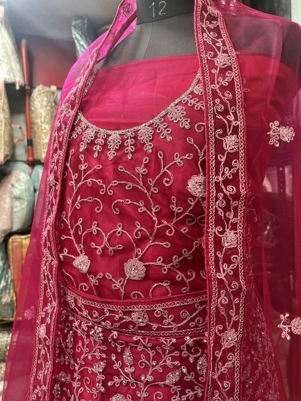 Magenta_Pink_Net_Bridal_Lehenga_Choli_Set_With_Heavy_Embroidery