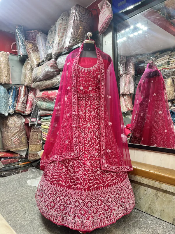 Magenta_Pink_Net_Bridal_Lehenga_Choli_Set_With_Heavy_Embroidery