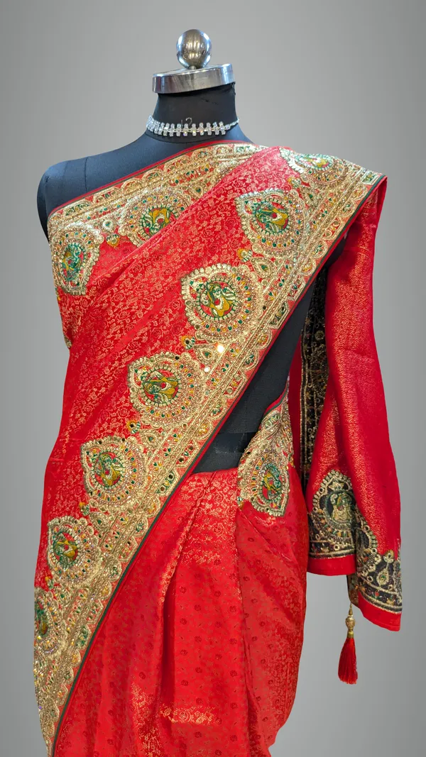 Red_Satin_Silk_Bridal_Saree_With_Heavy_Gold_Border_And_Peacock_Motifs