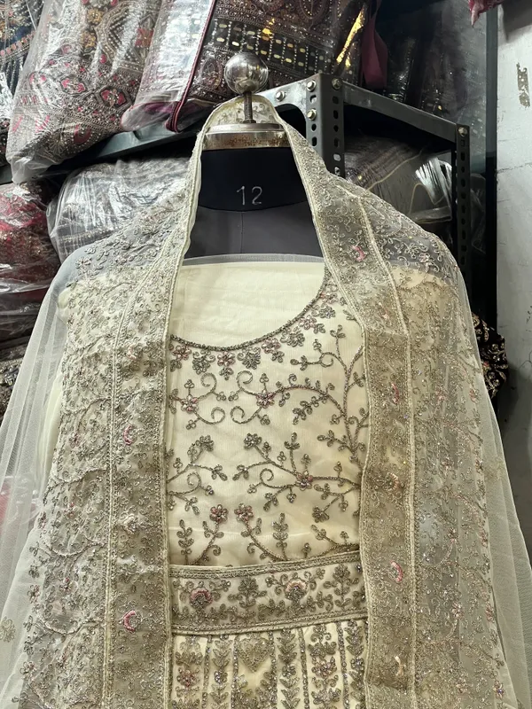 Ivory_Net_Bridal_Lehenga_Choli_Set_With_Floral_Embroidery