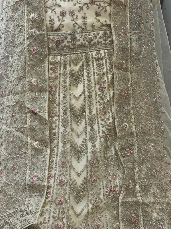 Ivory_Net_Bridal_Lehenga_Choli_Set_With_Floral_Embroidery