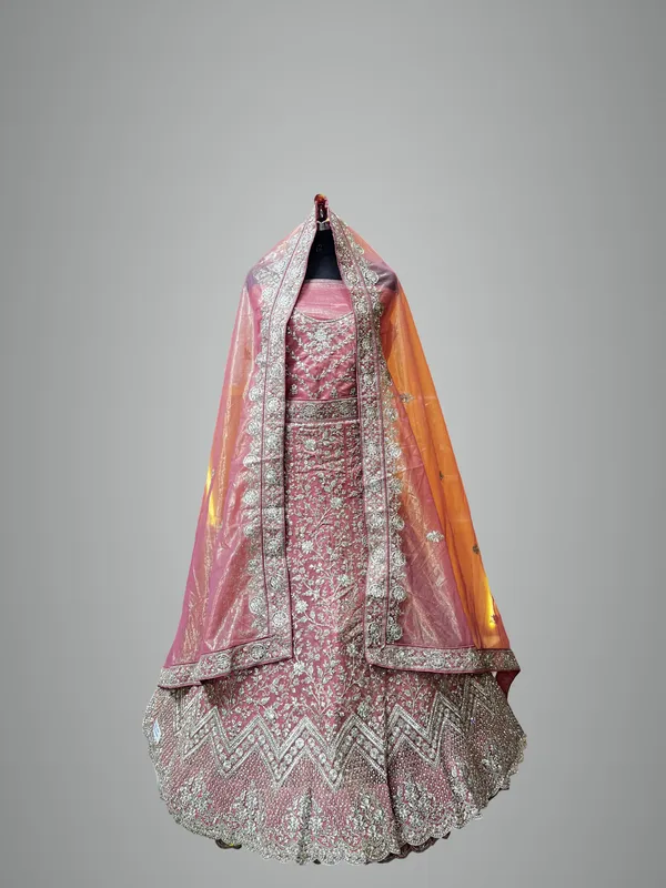 Pink_Net_Bridal_Lehenga_Choli_Set_With_Heavy_Embellished_Work_And_Dupatta