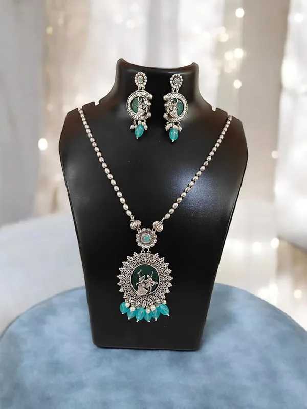 Turquoise_German_Silver_Necklace_Set_With_Radha_Krishna_Pendant_And_Earrings_For_Women