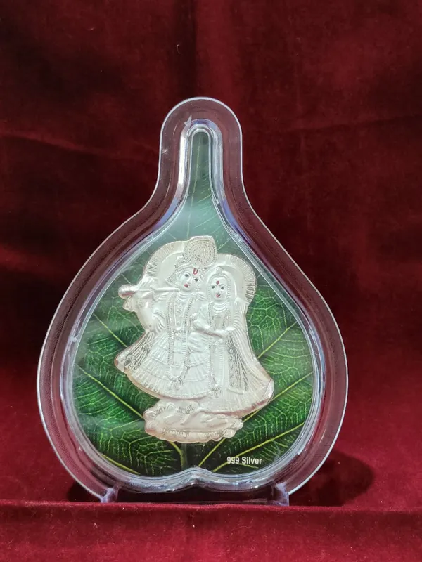 999_Silver_Radha_Krishna_Idol_In_Acrylic_Frame_With_Green_Base