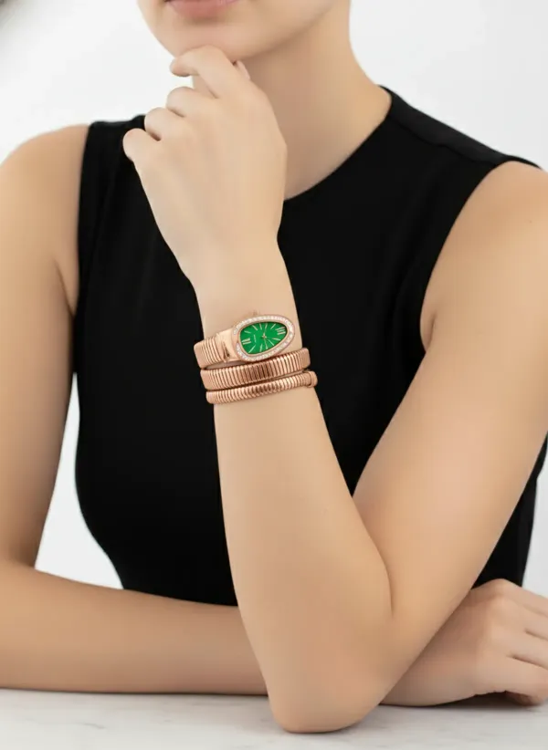 Gold_Toned_Snake_Coil_Watch_With_Teal_Dial_And_Crystal_Embellishments