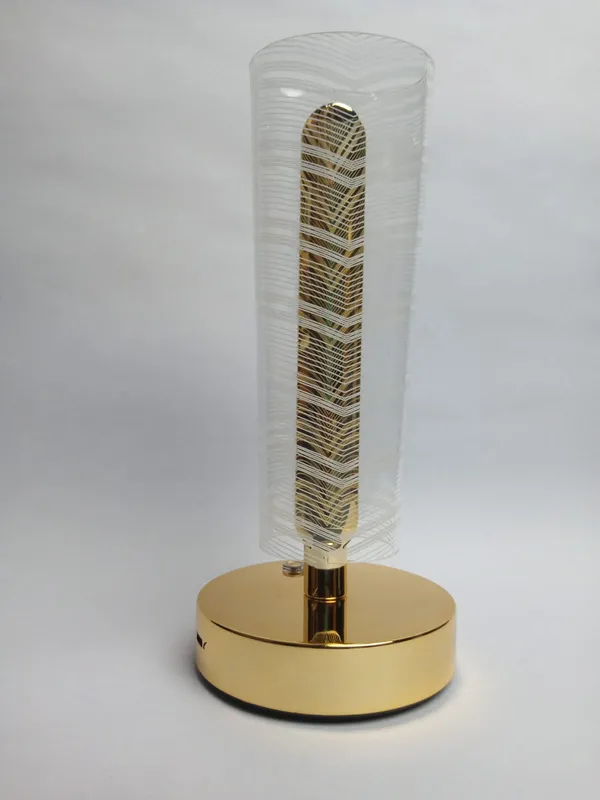 Golden_Cylindrical_LED_Table_Lamp_with_Decorative_Pattern
