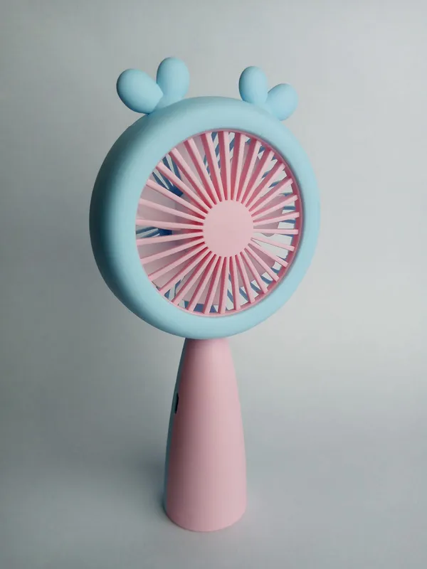Blue_and_Pink_Handheld_Portable_Battery_Fan_with_Cartoon_Design